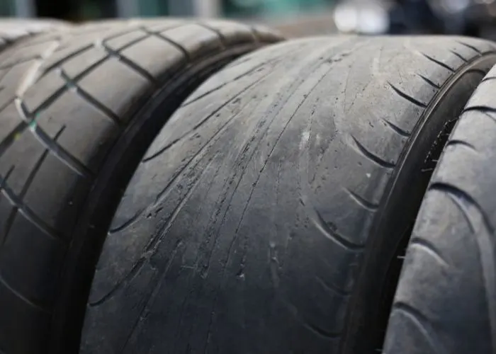 Tyres in a row with one worn