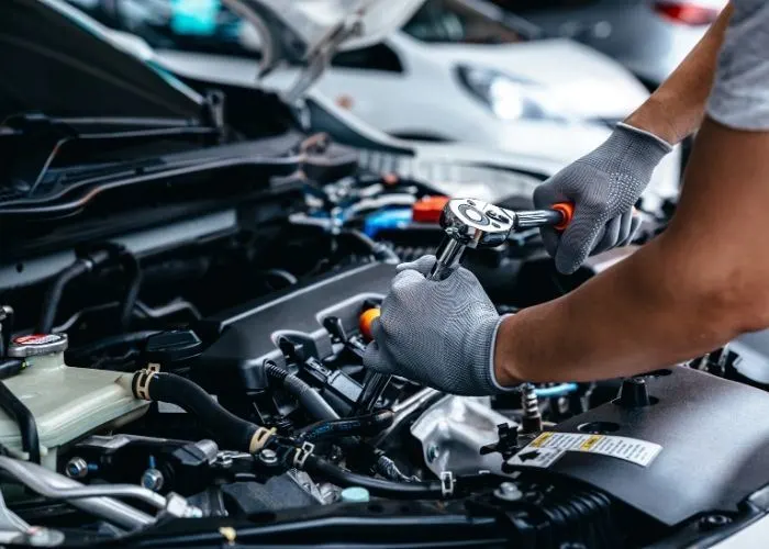Mechanic working on a car engine