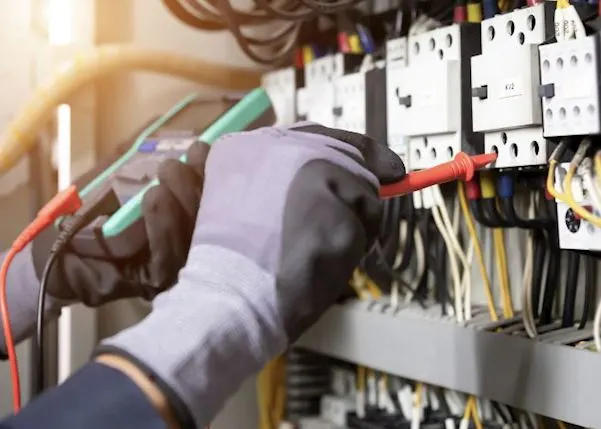 Electrician looking at cables