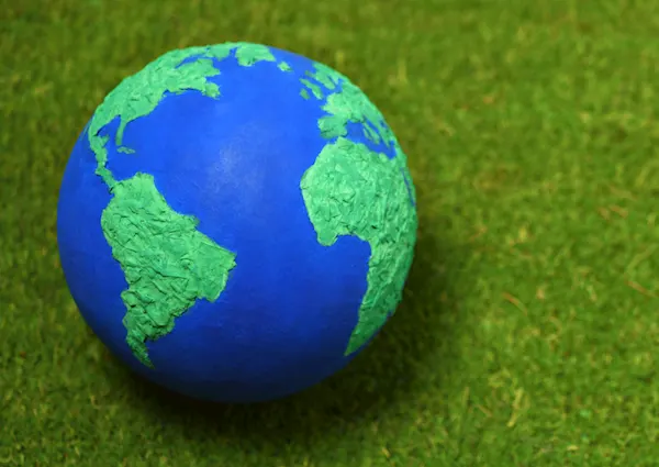 Planet earth on some grass background