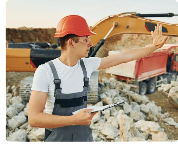 picture of a construction worker telling their team to hold up the work to check the job being scheduled.