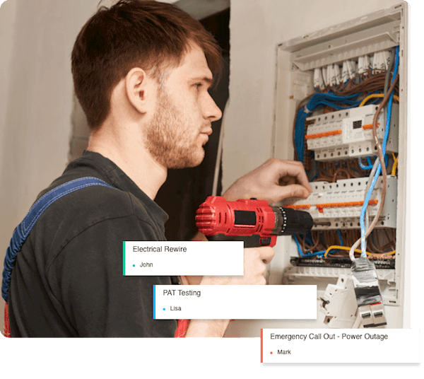 A worker fixing an electrical issue assigned to him by the job management software his company uses.