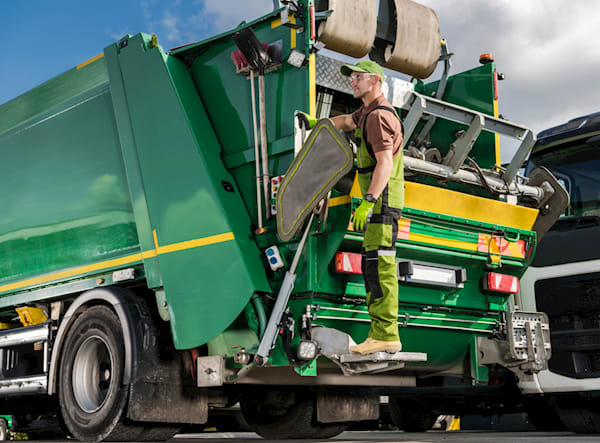 image of a waste management vehicle being tracked with a vehicle tracker and has had dash cams installed too.