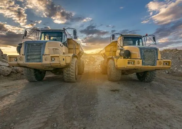 Construction vehicles stood in a worksite