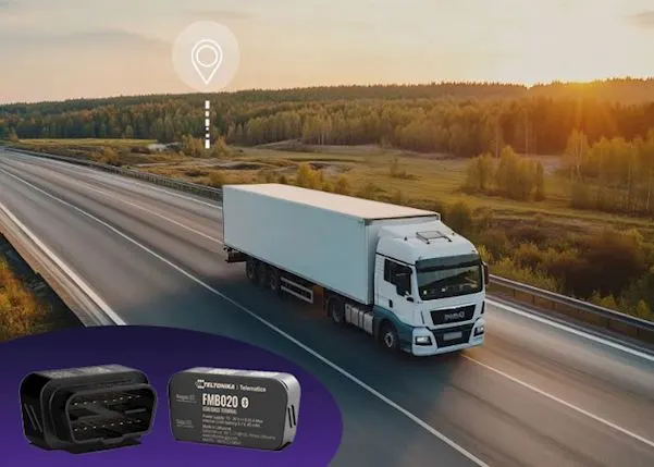 Truck driving on a road with an image of the OBD tracker on the left-hand side