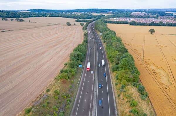Image of vehicles on a road being tracked by vehicle tracking
