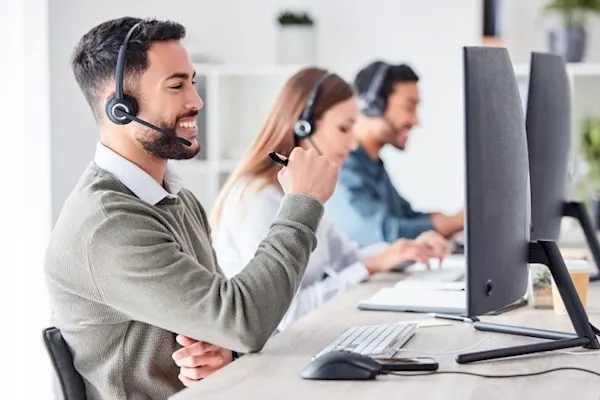 Image of Saas worker talking to customers.