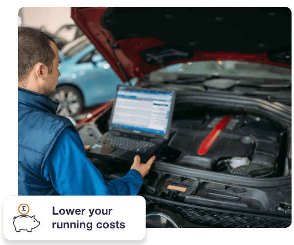 A man is looking at his engine and a laptop - in the bottom left of the image it says "lower your running costs"