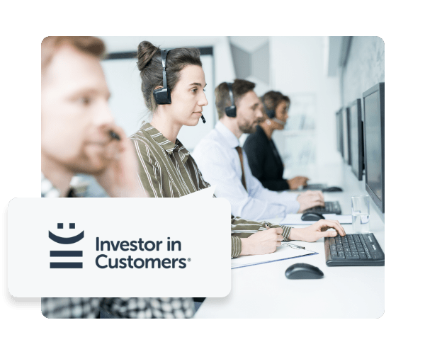 Two men and two women with headsets on in front of computers with a speech bubble coming from the closest woman with the Investors in Customers logo