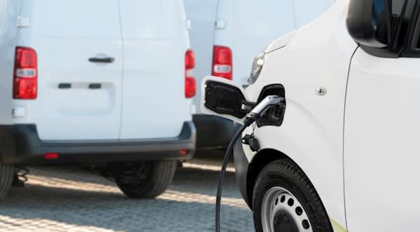 Image of an electric fleet van being charged.