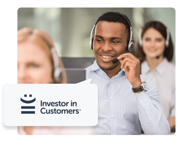 A man with a headset on in between two women with headsets on, a speech bubble is coming from him with the Investor in Customers logo