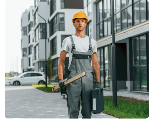 picture of a joiner entering a premises to work on one of his assigned jobs