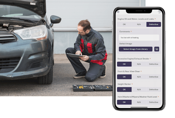 Man on a tablet is carrying out a vehicle check on a grey car. In the bottom right corner, there is an iPhone showing an example of the vehicle check