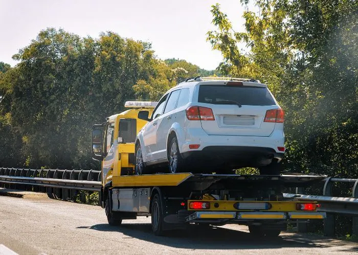 Car being towed on the road