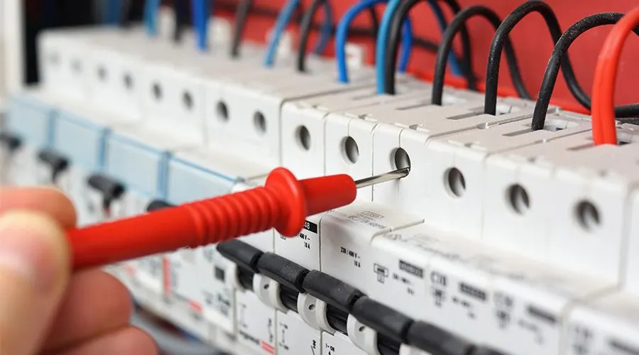 Electrician plugging in red wire