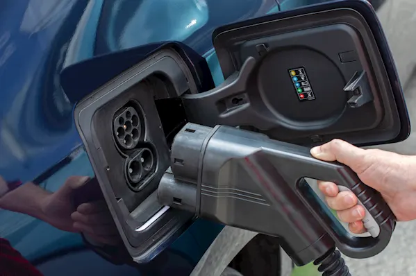 Close up of an electric vehicle's plug in socket for charging