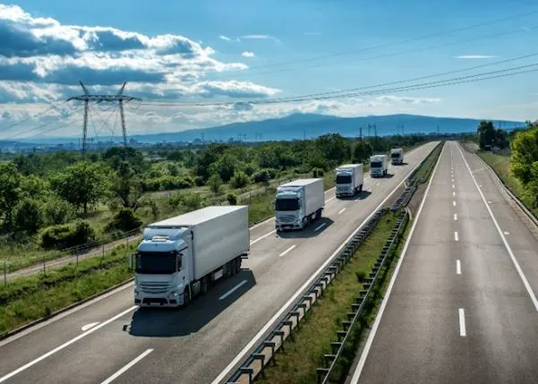 Trucks driving in a row on the highway