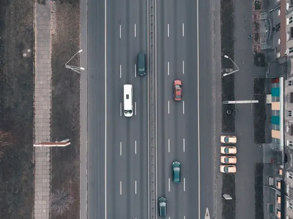Image of vehicles on a road being tracked by vehicle tracking