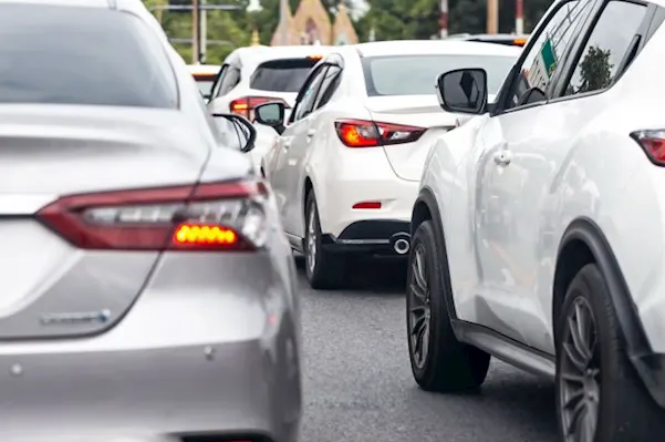 Image of dormant cars on a highway.